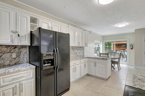 Fridge, microwave, oven, stovetop - Spacious & Modern Retreat -Patio Bar • Large Yard • Parking (Port St. Lucie)