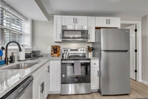 Fridge, microwave, dishwasher, dining tables