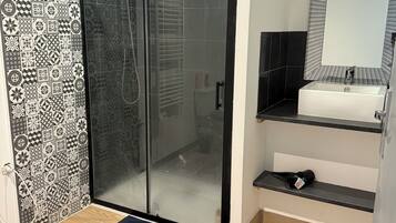 Shower, towels, soap, toilet paper