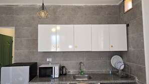 Fridge, microwave, stovetop, cookware/dishes/utensils