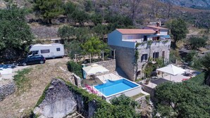 A villa with a swimming pool, a stone tower, and a caravan parked nearby. - Chic 3-bedroom apartment with AC, WiFi in charming Žrnovnica (Žrnovnica)