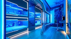 A modern hotel room with bunk beds, a laboratory area, and an aquarium. - Escape to Luxury: Magical 10-bedroom Villa Near Disney World! (Davenport)