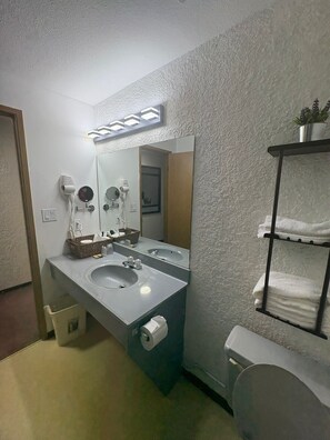 Hair dryer, towels, soap, shampoo