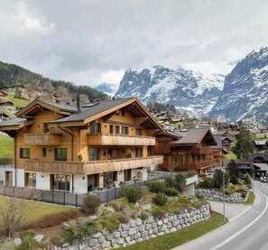 Experience the authentic alpine charm of this traditional chalet-style building, nestled among snow-capped peaks.