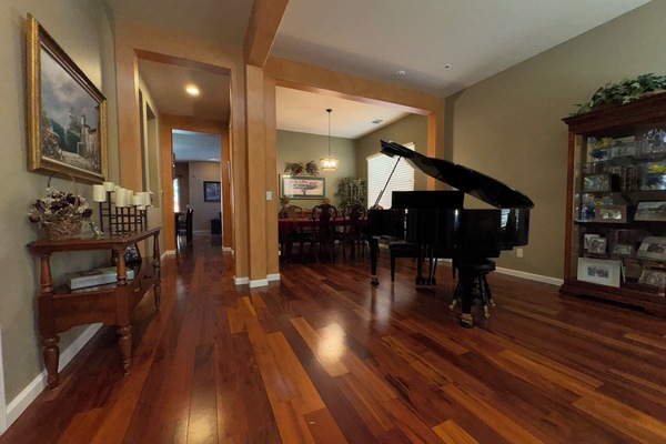 Welcome. As you enter my home you are greeted with beautiful hardwood floors.