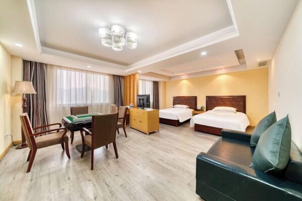 A hotel room with a pool table, a sofa, two beds, and a TV. - Huihe Hotel (Shangrao High Speed Railway Station) (Shangrao)