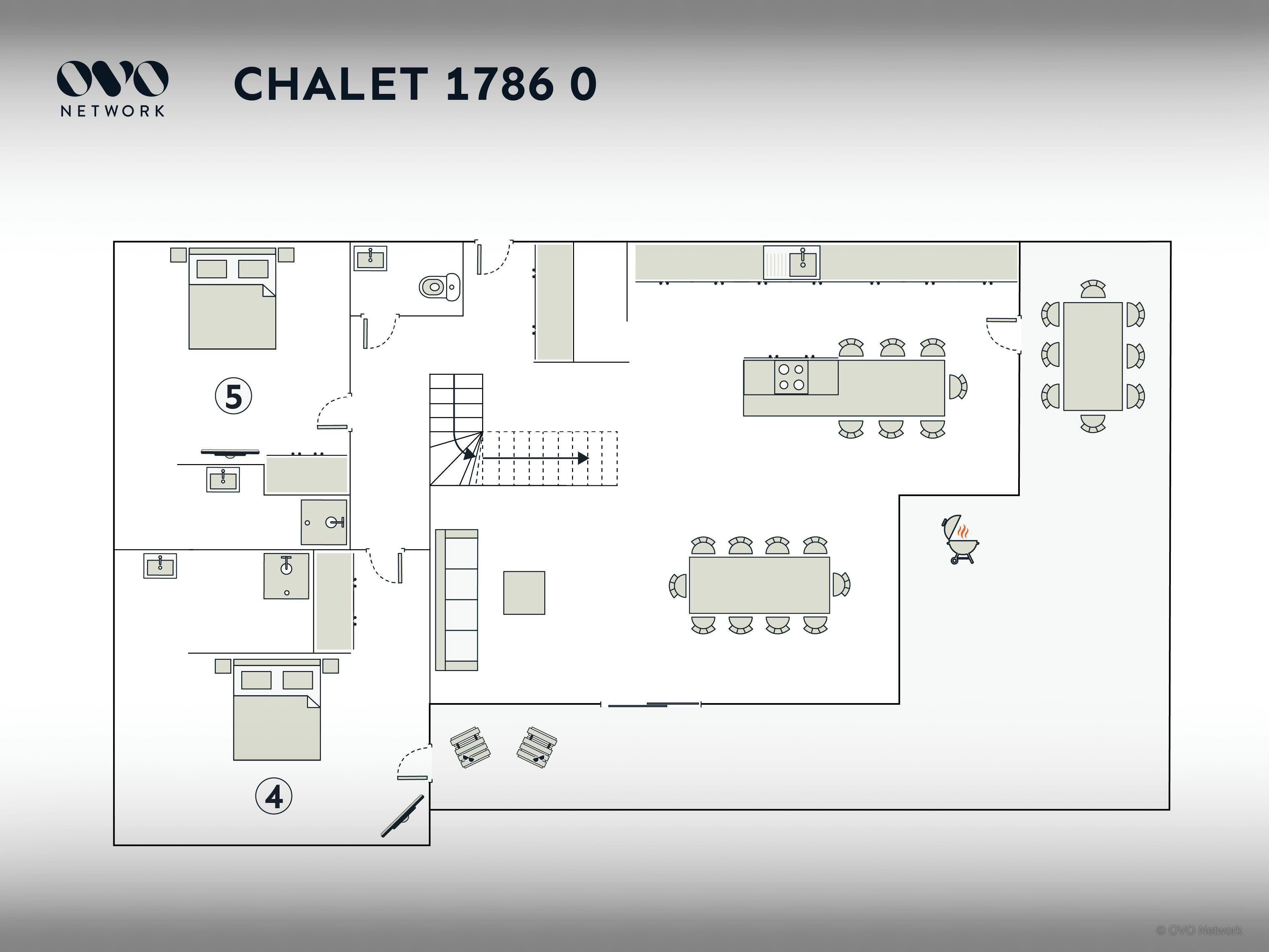Un plan d’étage d’une chambre d’hôtel comprenant un coin cuisine, un espace repas et une salle de bain.