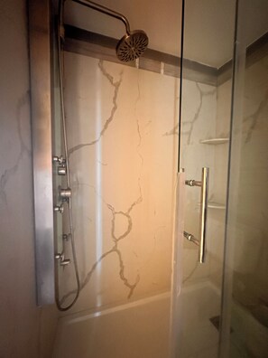 Shower, hair dryer, towels, toilet paper