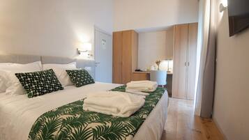 Premium bedding, memory-foam beds, minibar, in-room safe