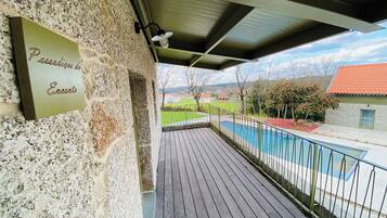 Deluxe Apartment, Pool View | Terrace/patio