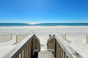 Walk along the boardwalk to the wide, open beach.