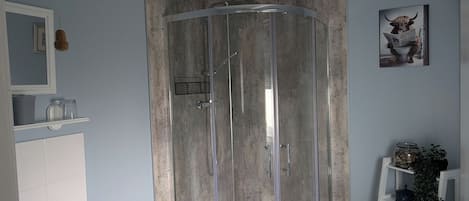 Shower, hair dryer, towels, soap