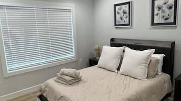 1 bedroom, desk, iron/ironing board, travel crib
