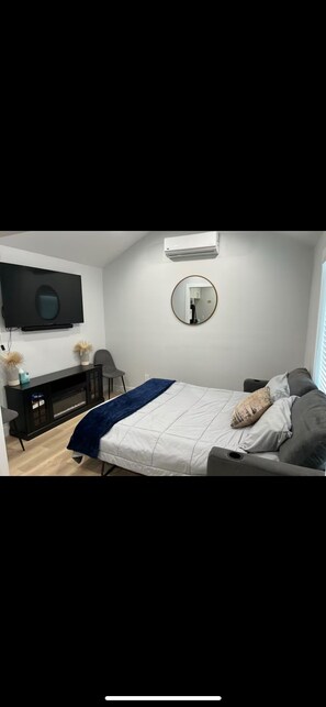 1 bedroom, desk, iron/ironing board, travel crib