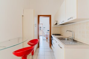 Fridge, stovetop, cookware/dishes/utensils
