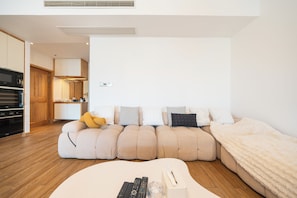 Superior Apartment, City View | Living area | TV