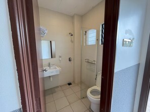 A bathroom with a white sink, mirror, and toilet. - Morib Prosper Resort by VP (Banting)