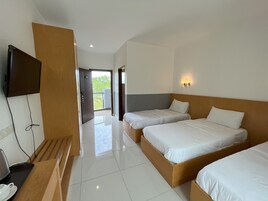 Deluxe Triple Room, Garden View | Individually furnished, desk, laptop workspace, free WiFi