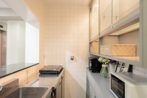 Fridge, microwave, cookware/dishes/utensils