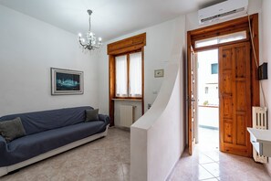 Family Apartment, Multiple Bedrooms (Casa Torre San Giovanni Near the Sea) | Living area | 21-inch TV with cable channels - Casa Torre San Giovanni Near the Sea (Ugento)