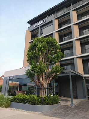 A multi-story building with the name "THE RICHER" on the facade.