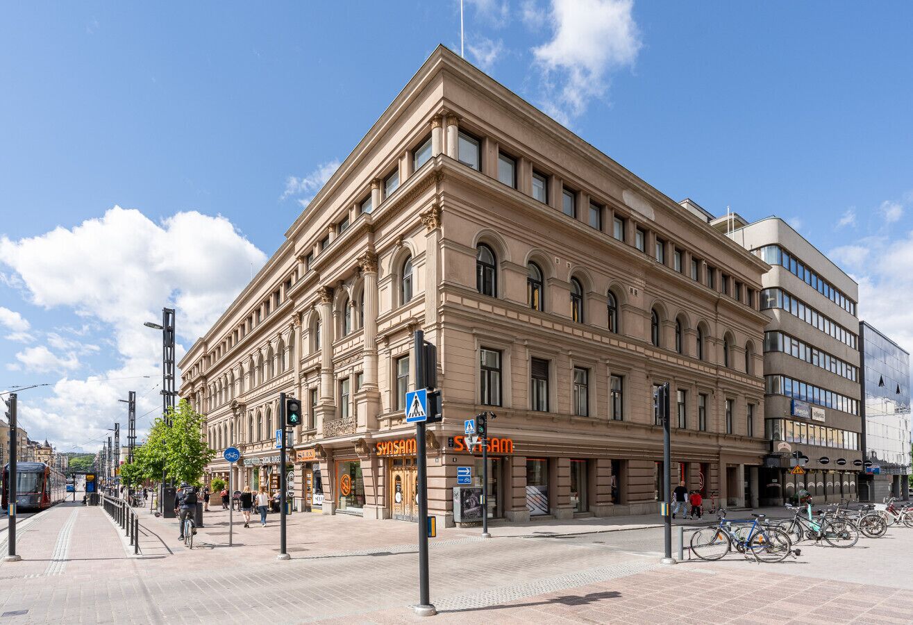 A historic building with a classic architectural style, featuring a prominent entrance and multiple windows.