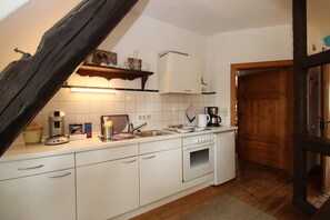 Deluxe Apartment, 2 Bedrooms | Private kitchen | Fridge, microwave, oven, stovetop