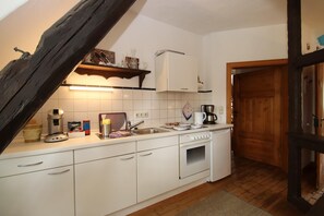 Deluxe Apartment, 2 Bedrooms | Private kitchen | Fridge, microwave, oven, stovetop