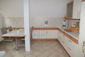 Classic Apartment, 3 Bedrooms | Private kitchen | Fridge, microwave, oven, dishwasher