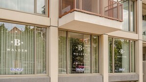 A building with large windows displaying the logo "B. Walden" and the text "BizStay short stay apartments." - Sustainable Stay with Terrace (Den Haag)