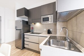 Fridge, microwave, stovetop, coffee/tea maker