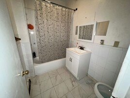 Combined shower/tub, soap, toilet paper