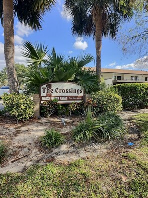 A sign for The Crossings with addresses 7201, 7203, and 7205 Curtiss Ave. - This is a newly renovated two bed / two bath condominium. (Sarasota)