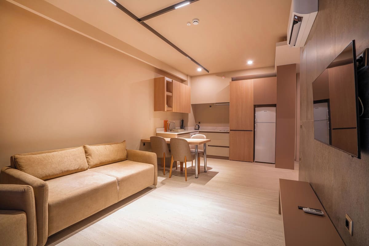 Apartment, 1 Bedroom, Kitchen, Pool View | Living area | 43-inch Smart TV with satellite channels, Netflix, streaming services
