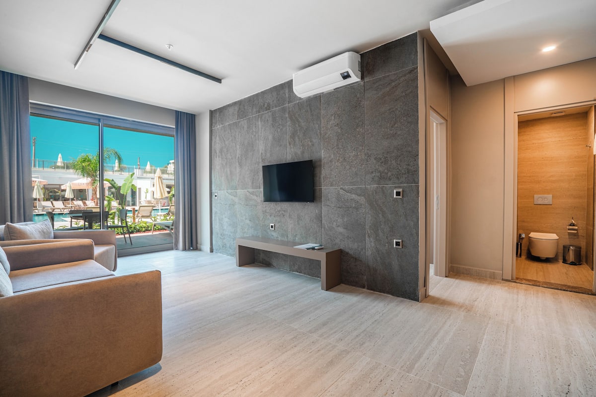 Apartment, 1 Bedroom, Patio, Poolside | Living area | 43-inch Smart TV with satellite channels, Netflix, streaming services