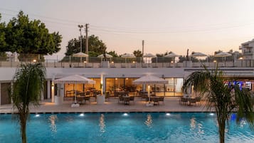 Seasonal outdoor pool, open 7:30 AM to 7:30 PM, pool umbrellas