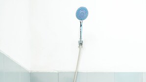 A shower with a handheld showerhead and a handheld hose. - Rehat at Paskal Pelangi (Bandung)