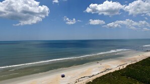 A beach with a clear sky and waves. - Beach Front 5 bed 4 Bath Luxury House Hot Tub Fenced Yard Pets Welcome (Palm Coast)
