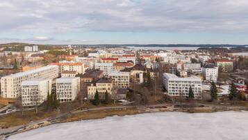 A cityscape with various buildings, including multi-story residential and commercial structures.
