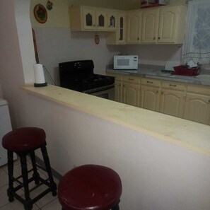 Blender, cookware/dishes/utensils - Tranquil haven. Lovely and spacious two bedroom bungalow very large sitting room (Montego Bay)