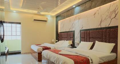 Deluxe Twin Double Bedroom with Private Ganga View Balcony.
