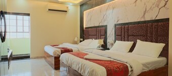 Deluxe Twin Double Bedroom with Private Ganga View Balcony.