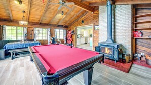 A pool table in a wooden room with a fireplace and a bench. - 9 Mi to Spanaway Park: Home w/ Indoor Hot Tub (Spanaway)