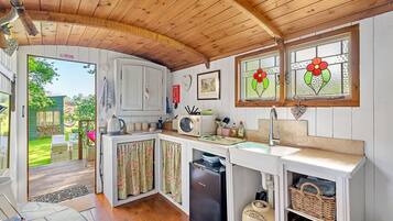 Fridge, microwave, electric kettle, cookware/dishes/utensils