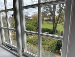 Enjoy a serene view of the lush garden from the comfort of your room.
