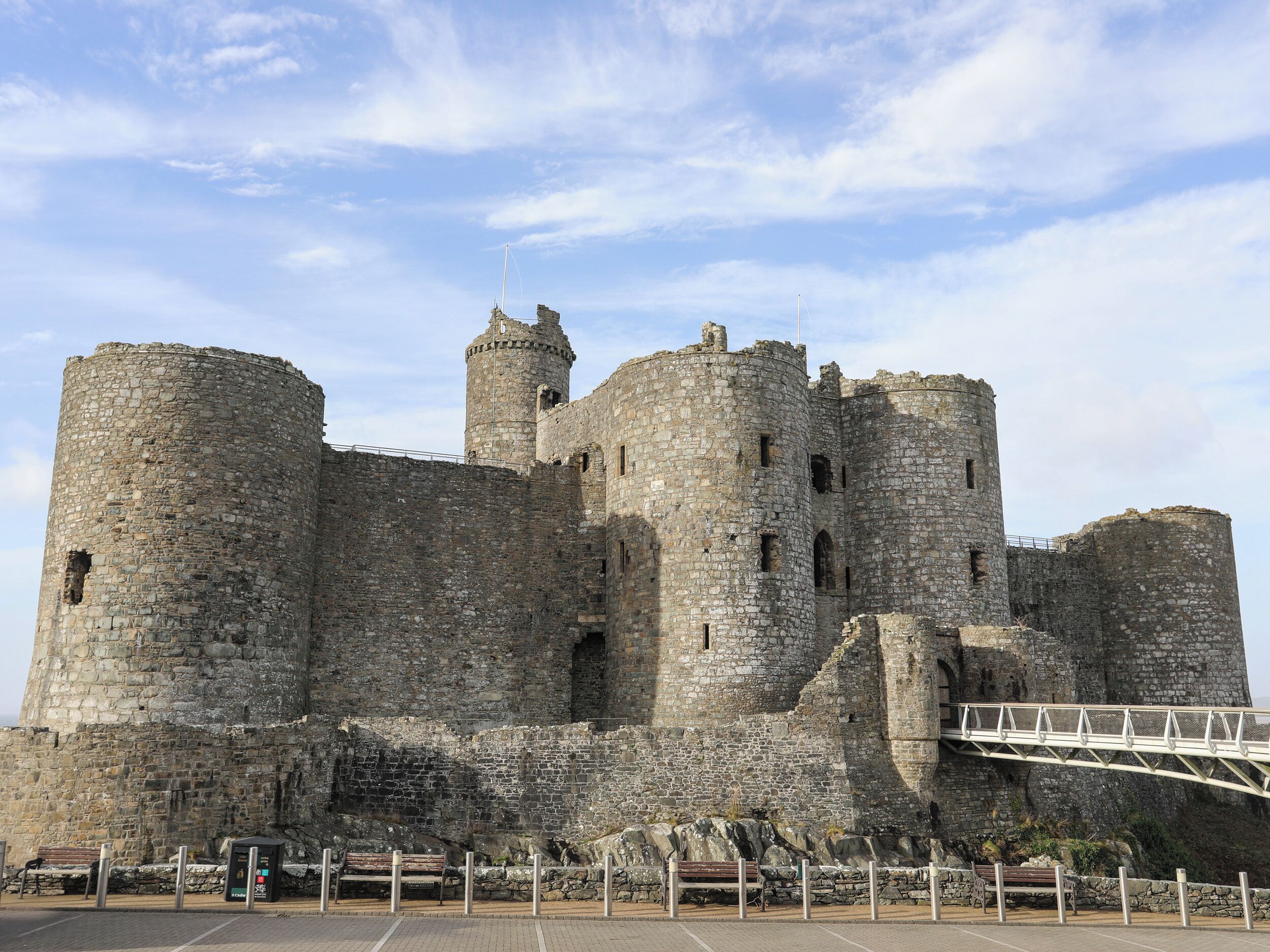 A historic stone castle with multiple towers and a fortified wall.