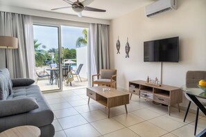 Superior Apartment, Pool View | Living room | 43-inch Smart TV with satellite channels - Narcissos Nissi Beach Apartment C5 (Ayia Napa)