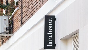A building with a sign reading "limehome" and a number "96" on the door. - Limehome Madrid Calle de Matilde Diez (Madrid)