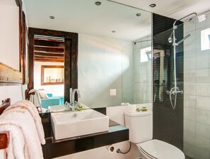 Shower, hair dryer, towels, shampoo