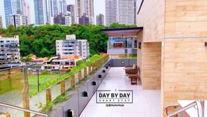A modern building with a staircase leading to a rooftop terrace. - Fortune by Day by Day (Joao Pessoa)